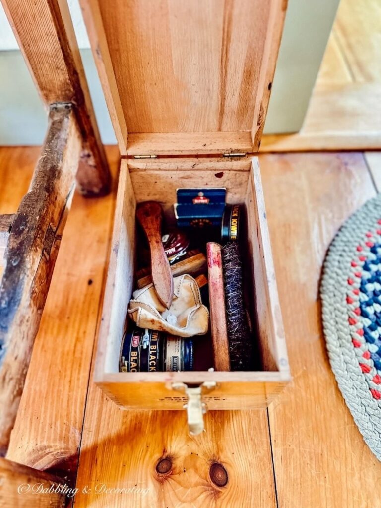 Vintage Esquire Shoe Valet open with shoe polish, brushes, and cloths.