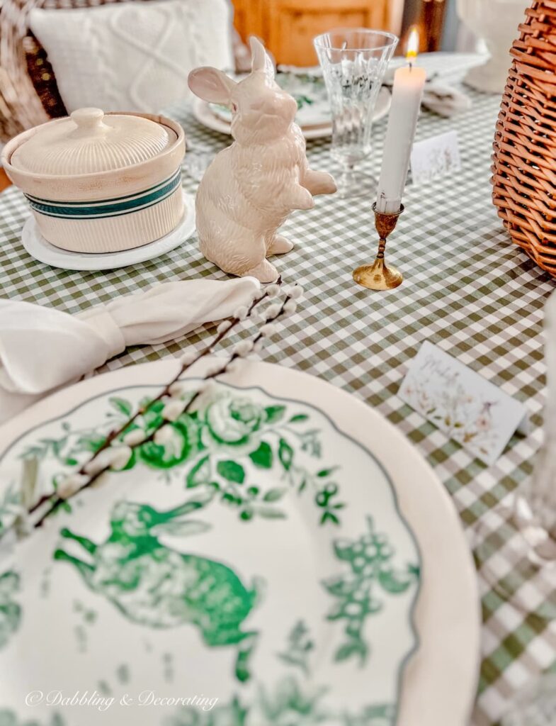 Green and white place setting for Easter Tablescape with gingham tablecloth and ceramic bunny with vintage touches.