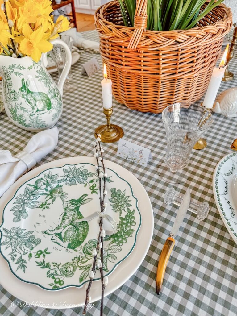 Green and white Easter Tablescape on green gingham tablecloth with Daffodils and basket of Paperwhites.