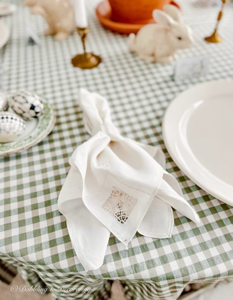 White Irish Linen Napkin on green and white gingham table cloth on Easter Tablescape.