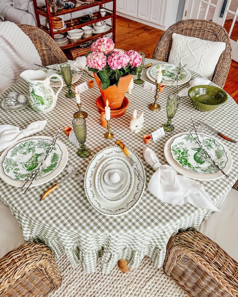 Easter Tablescape in green, pink, and white with gingham tablecloth and pink hydrangeas centerpiece.