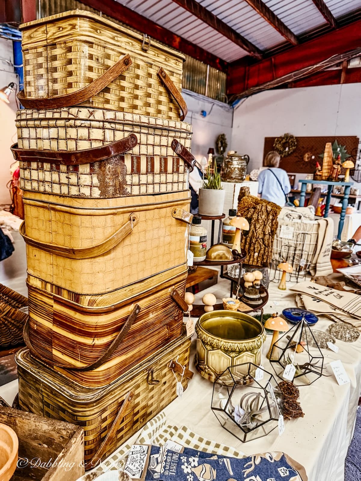 Stack of brown and yellow metal picnic baskets at VMD Vermont on a Vermont fall weekend.