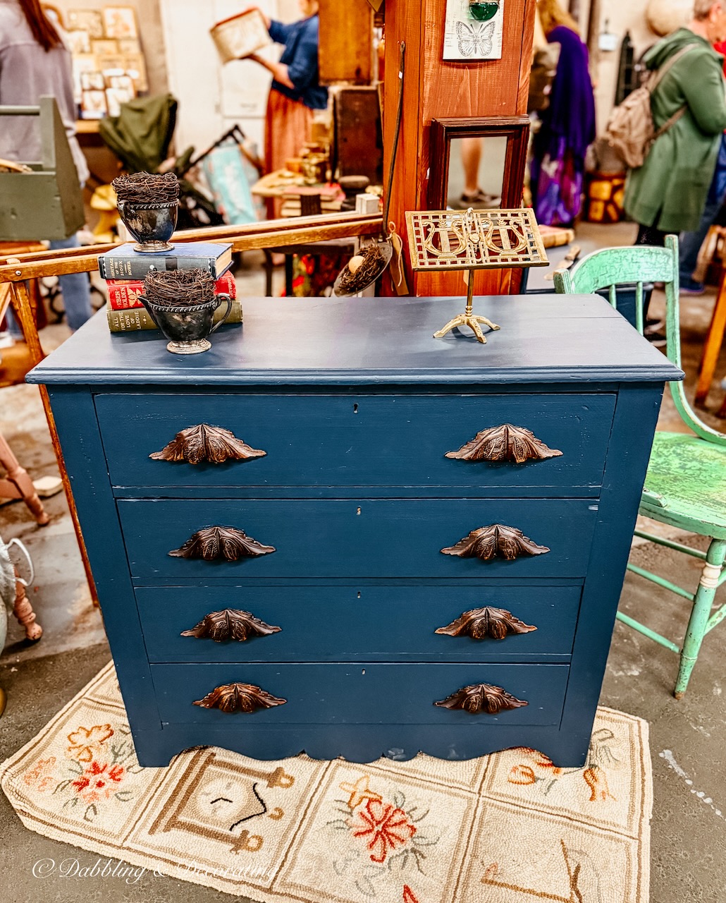 Navy antique dresser with oak wood handles at Vintage Market Days.