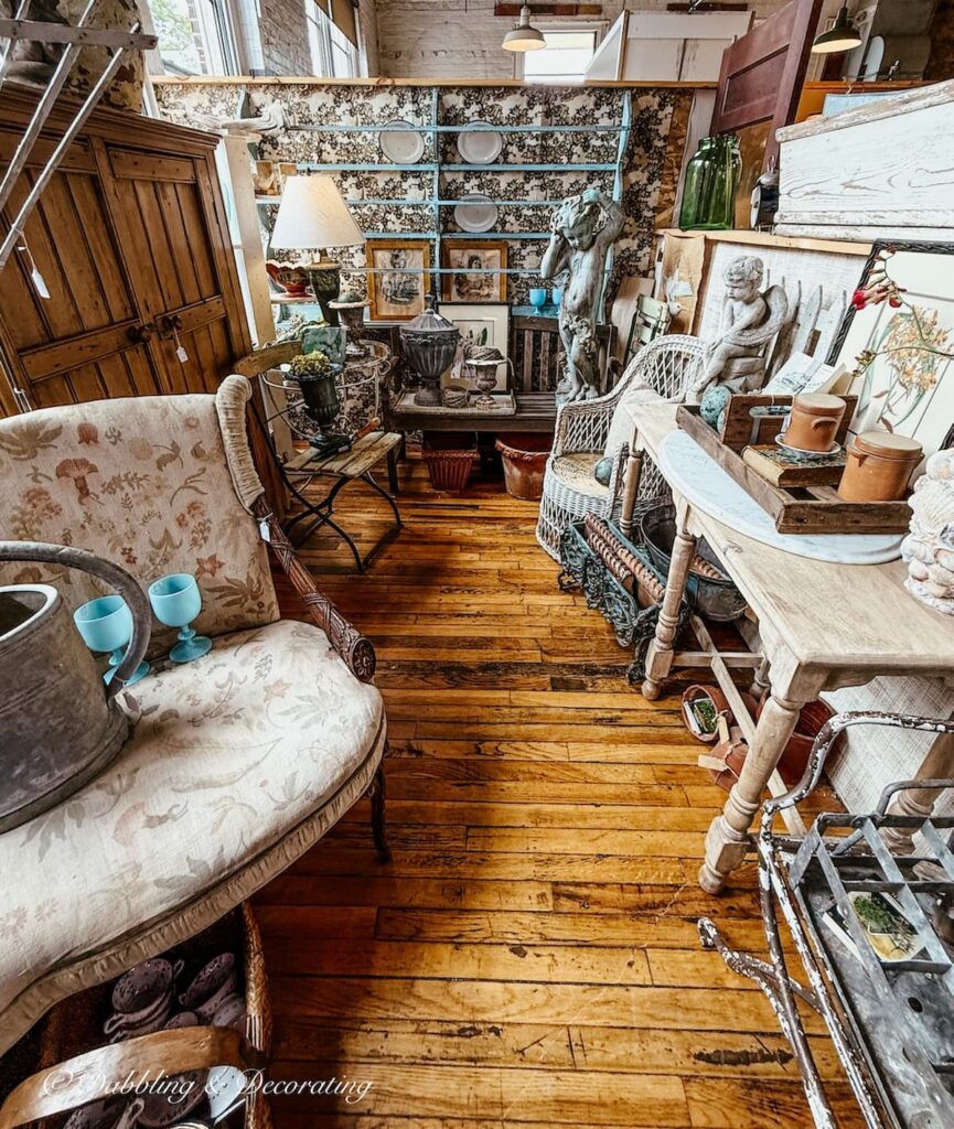 Inside a vendor's booth at Portland's Antique Mall in Maine styled for summer with turquoise and terracotta details.
