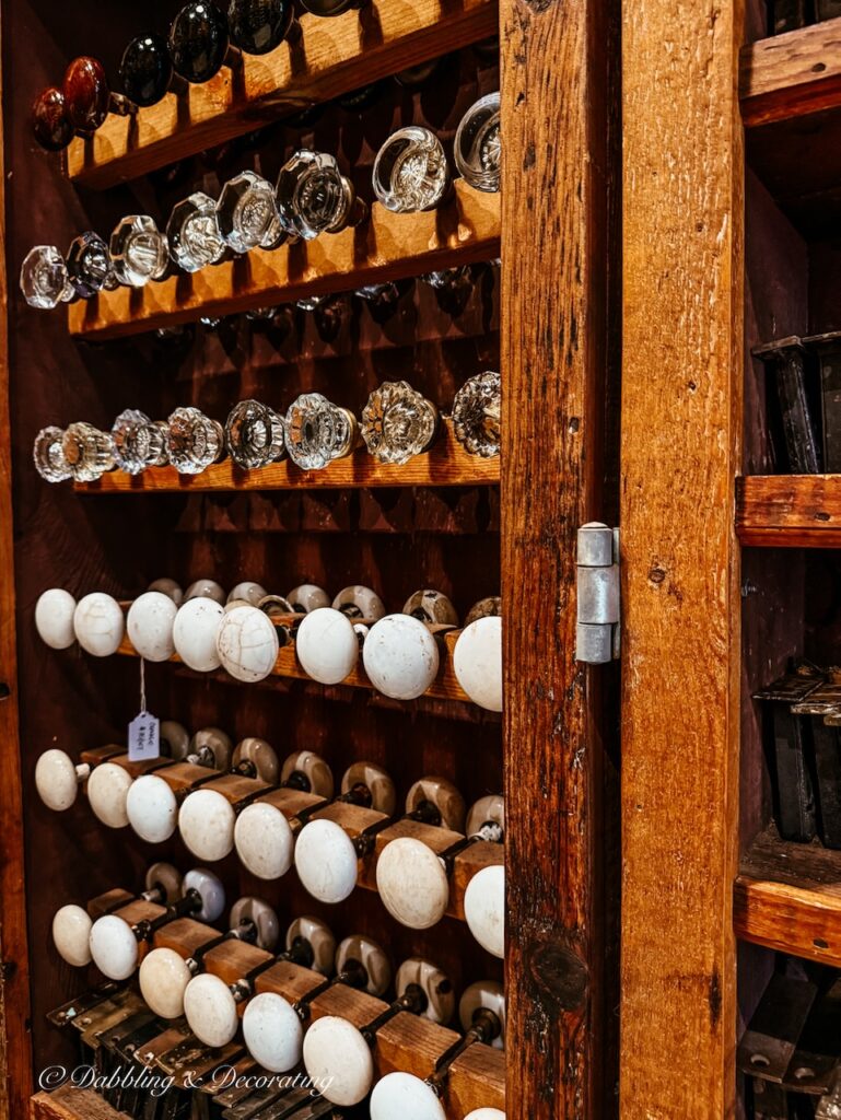 Old House Parts Co. Kennebunk, Maine. Wall of Antique door knobs.