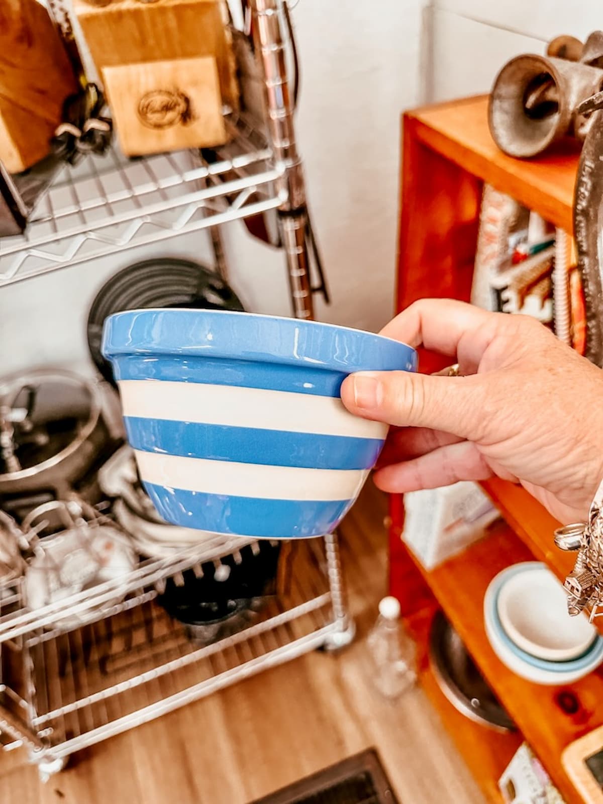Cornishware small bowl in hand at antique store.