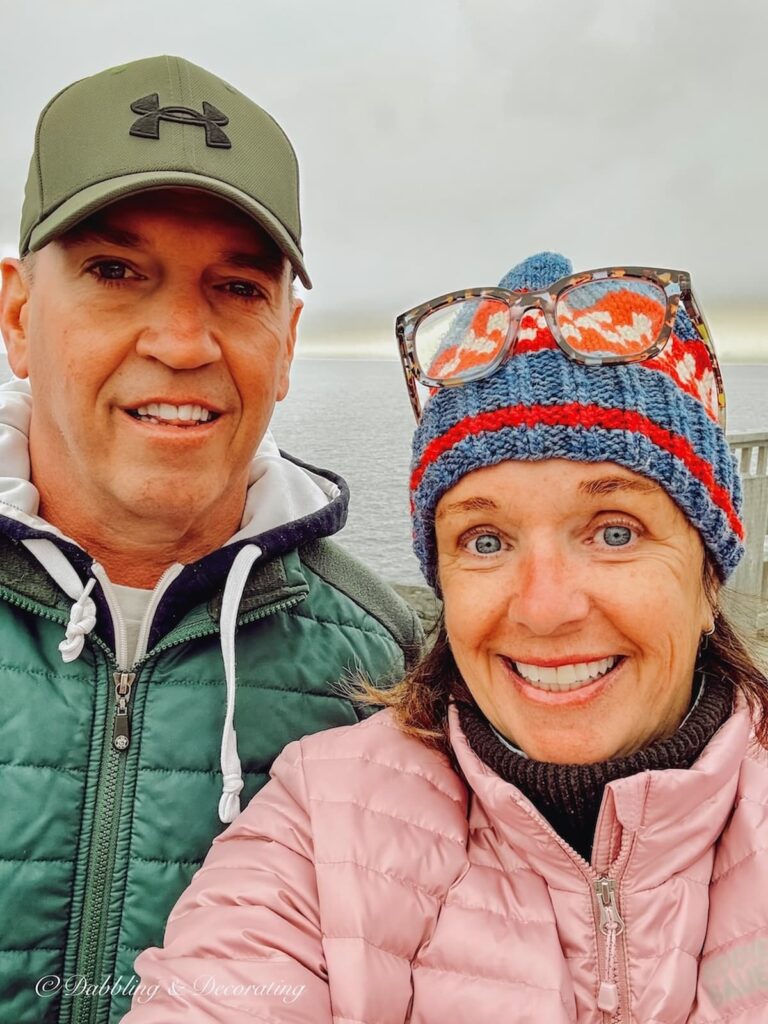 Man and Woman bundled up in Newfoundland smiling at the camera.