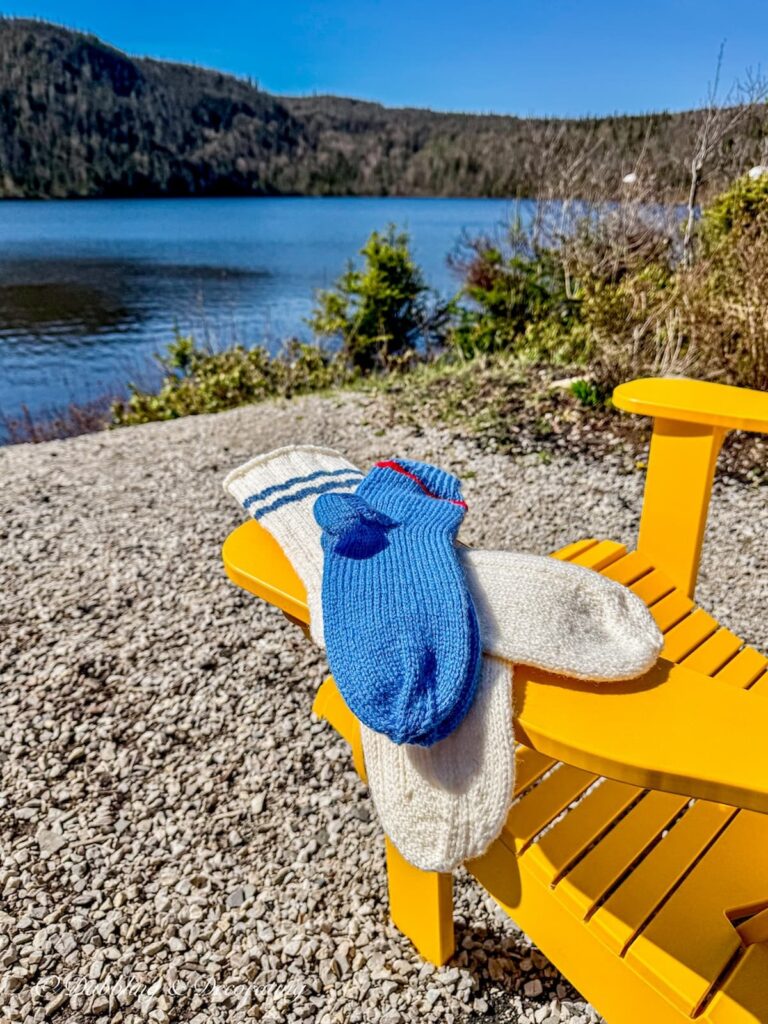 Handmade in Newfoundland wool socks on yellow Adirondack chair.
