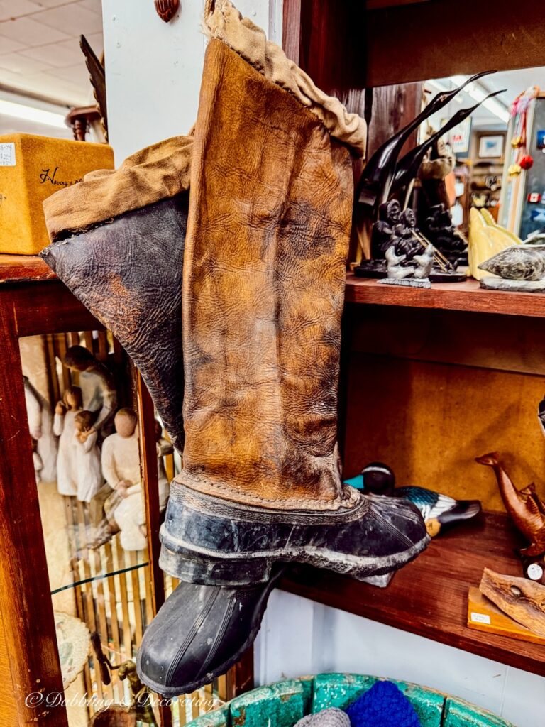 Old maritime leather boots in antique store.