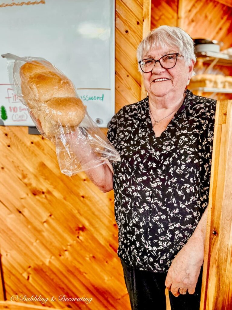Woman with loaf of homemade bread in Newfoundland