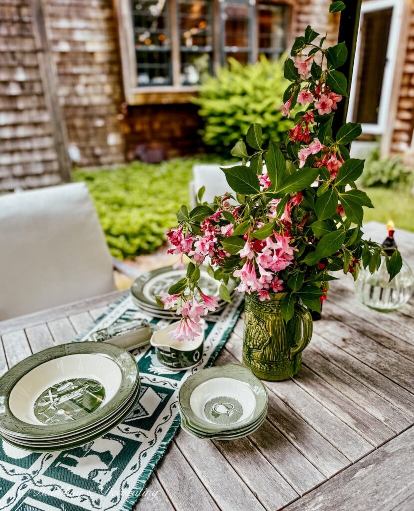 Set of Colonial Homestead in Green by Royal on Goodwill Northern New England, summer decor finds displayed on outdoor teak table.