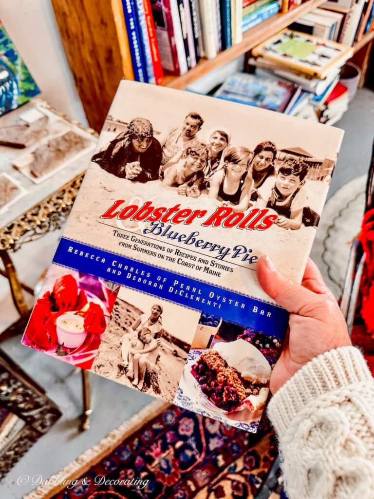Lobster Rolls and Blueberry Pie Recipes book in hand for Vintage Coastal Decor.