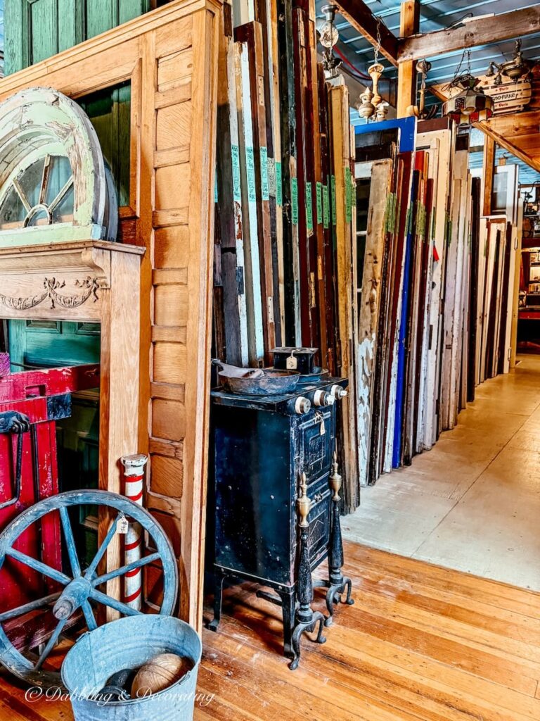 Inside shot of rows of architectural salvaged old doors at Old House Parts Co. in Kennebunk, Maine.
