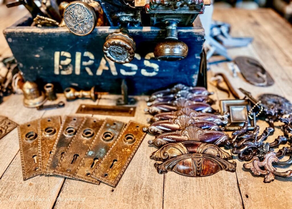 Antique door knob foundations on counter with vintage doorknobs.