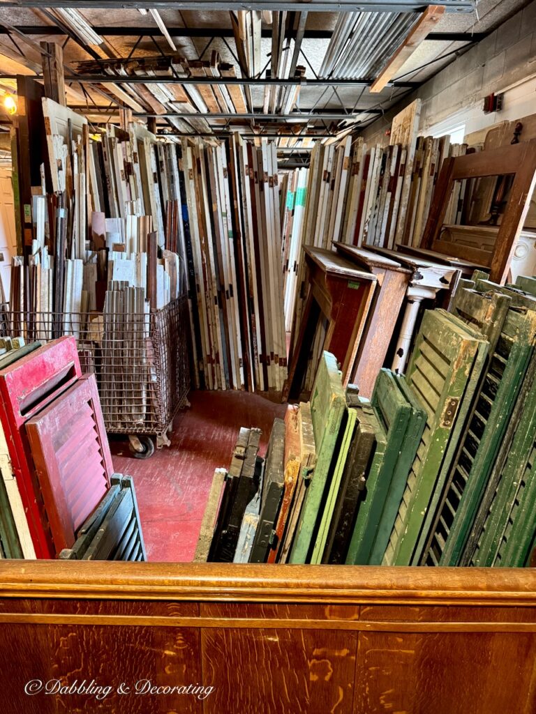 Architectural Salvage old doors organized in back of box of vintage shutters at The Old House Parts Co.