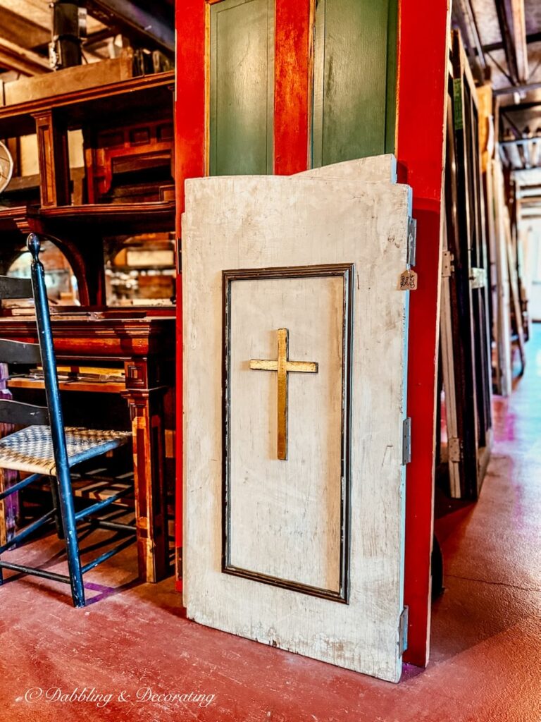 Salvaged shutters from a church with a cross on them at Old House Parts Company.