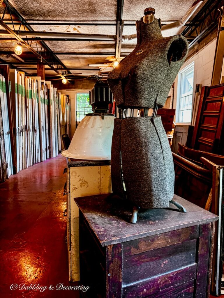 Vintage mannequin standing guard on second floor of Old House Parts Co.