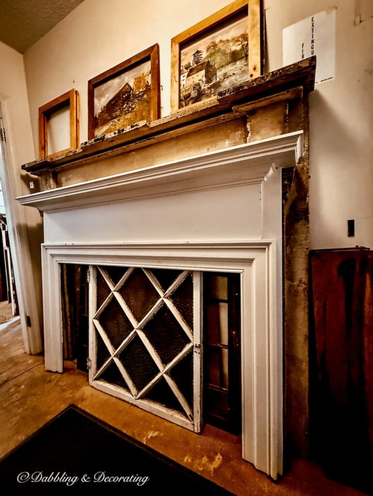 Large antique salvaged mantel for house in antique store.