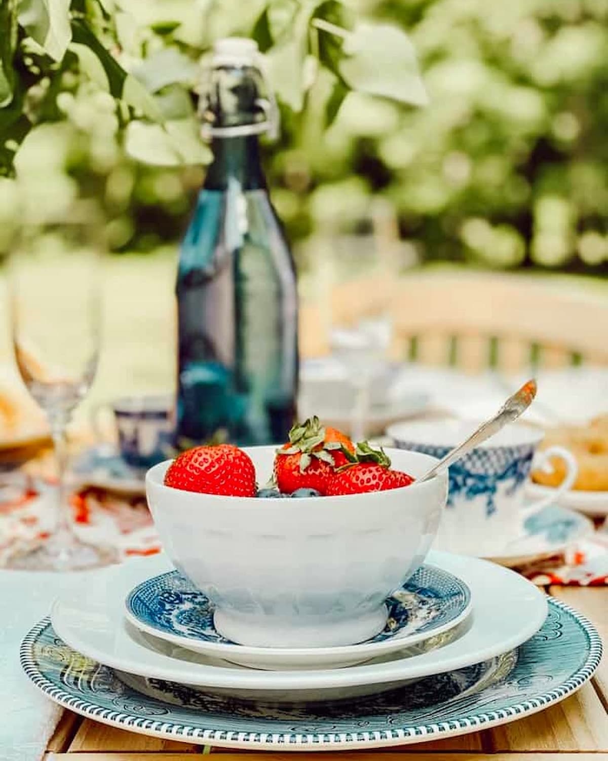 Summer table decorations for labor day weekend with red, white, and blue vintage place settings.