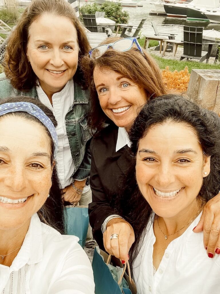 Four women on a thrift store shopping trip in Maine.