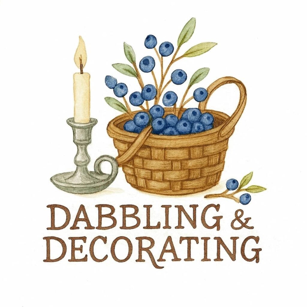 Dabbling & Decorating Logo with basket of blueberries and pewter candlestick.