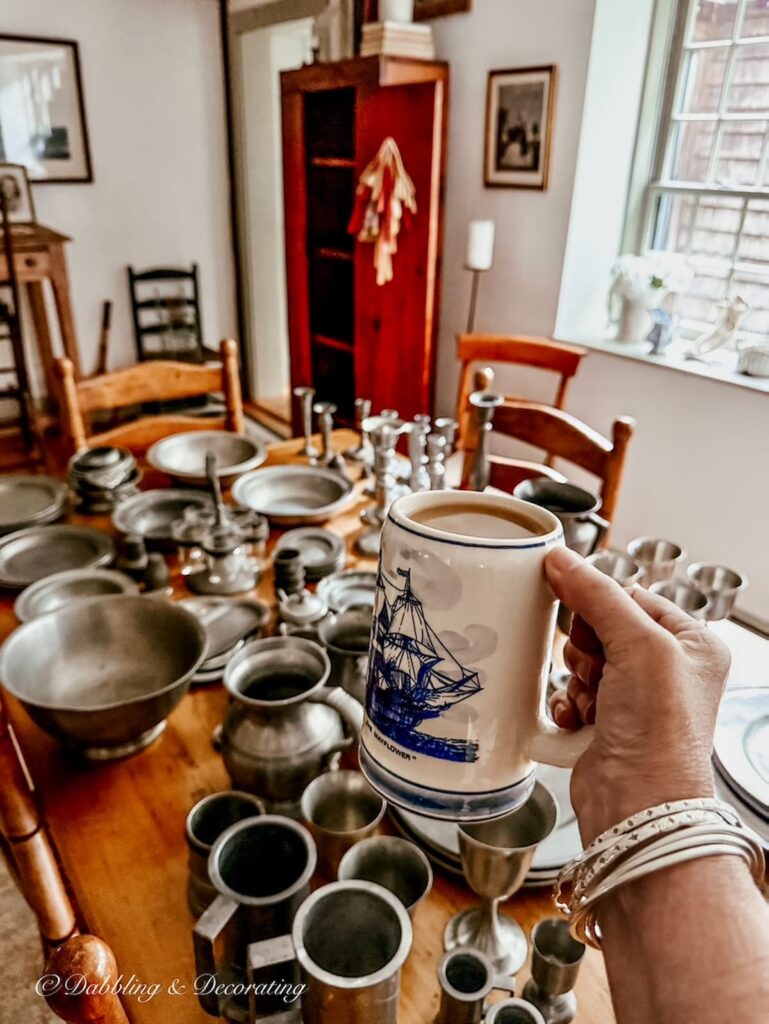 How to style an antique hutch with a pewter collection with vintage home decor blogger with Delft mug and morning coffee cheering on.