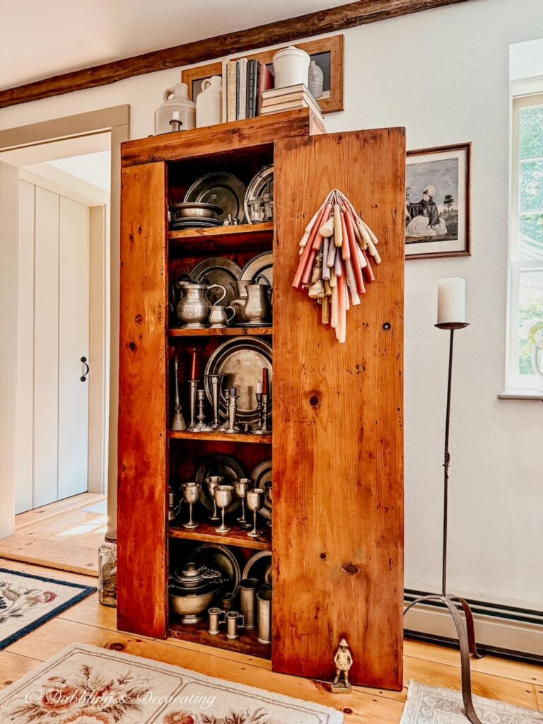 How to style an antique hutch with pewter in Early American home.