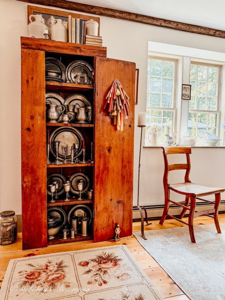 How to style an antique hutch with pewter in Early American home.