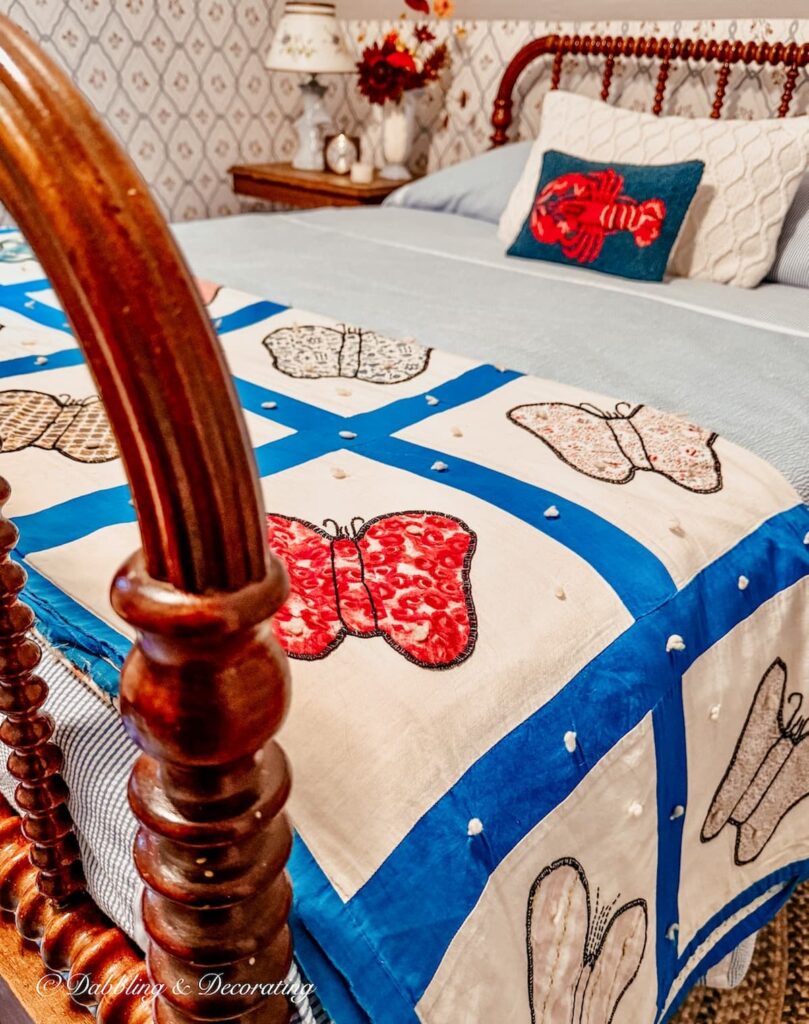 Antique handmade quilt on an antique Jenny Lind bed makeover in attic bedroom with butterflies.