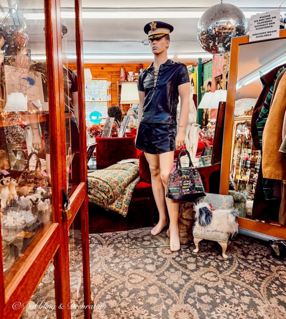 Male mannequin dressed in police uniform with shorts and bag at R.S. Butler’s Trading Company
