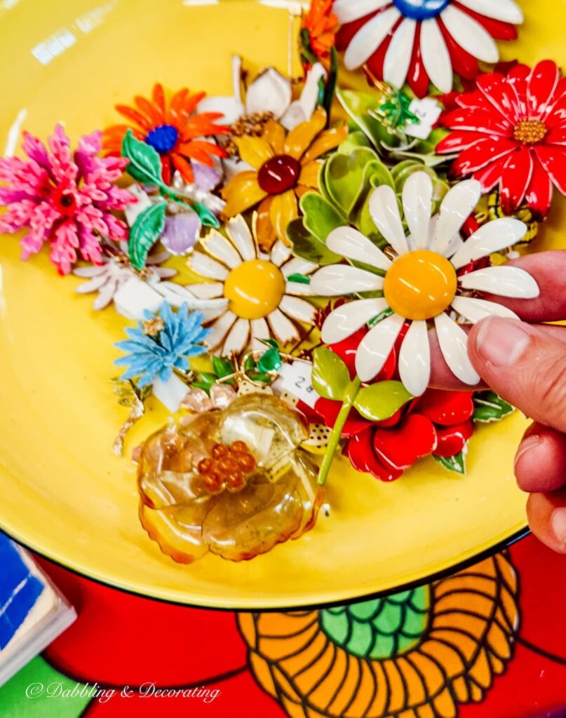 Yellow bowl filled with retro vintage colorful pins inside RS Butler's Trading Company in New Hampshire.