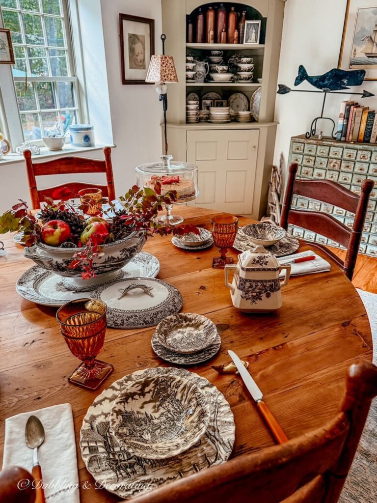 Round vs. Rectangular dining table in dining room with vintage and antique details.