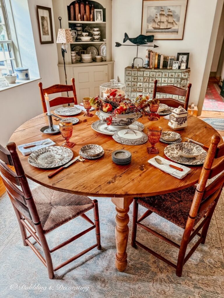 Round vs. Rectangular dining table in antique New England Home decor.