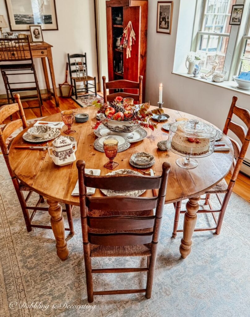 Round vs. rectangular dining table in antique styled dining room in New England home.
