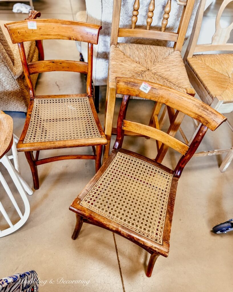 Two ladder back vintage cane chairs at Goodwill Northern New England.