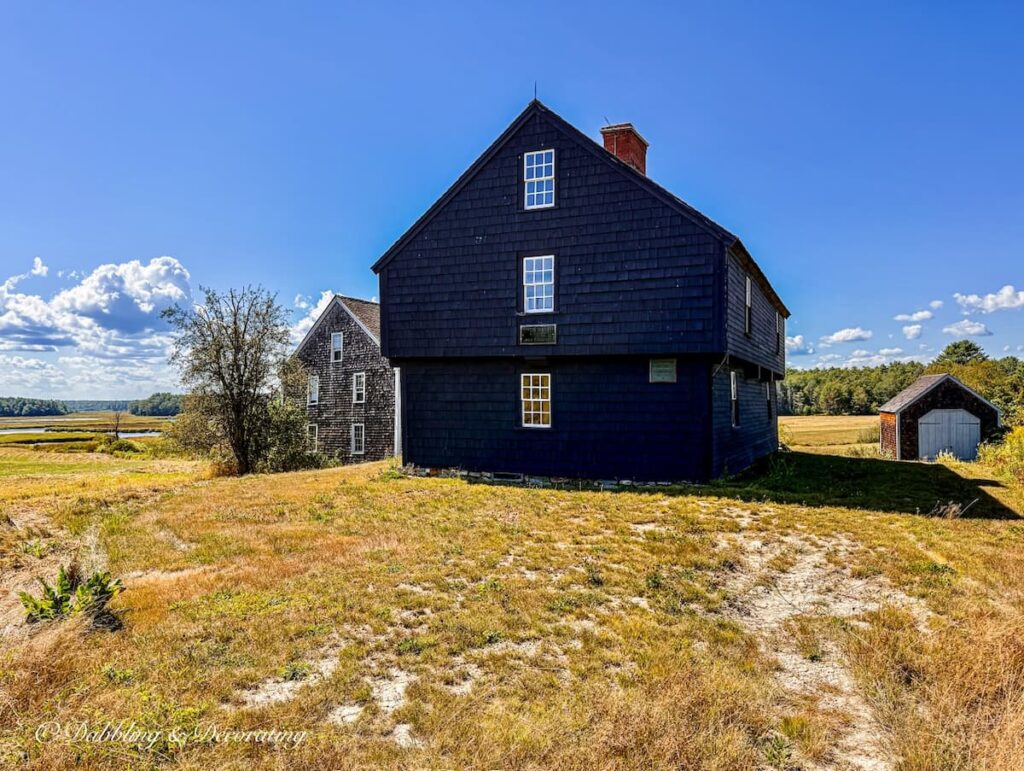 Historical New England farmhouse and barn in Maine in fall decor ideas.