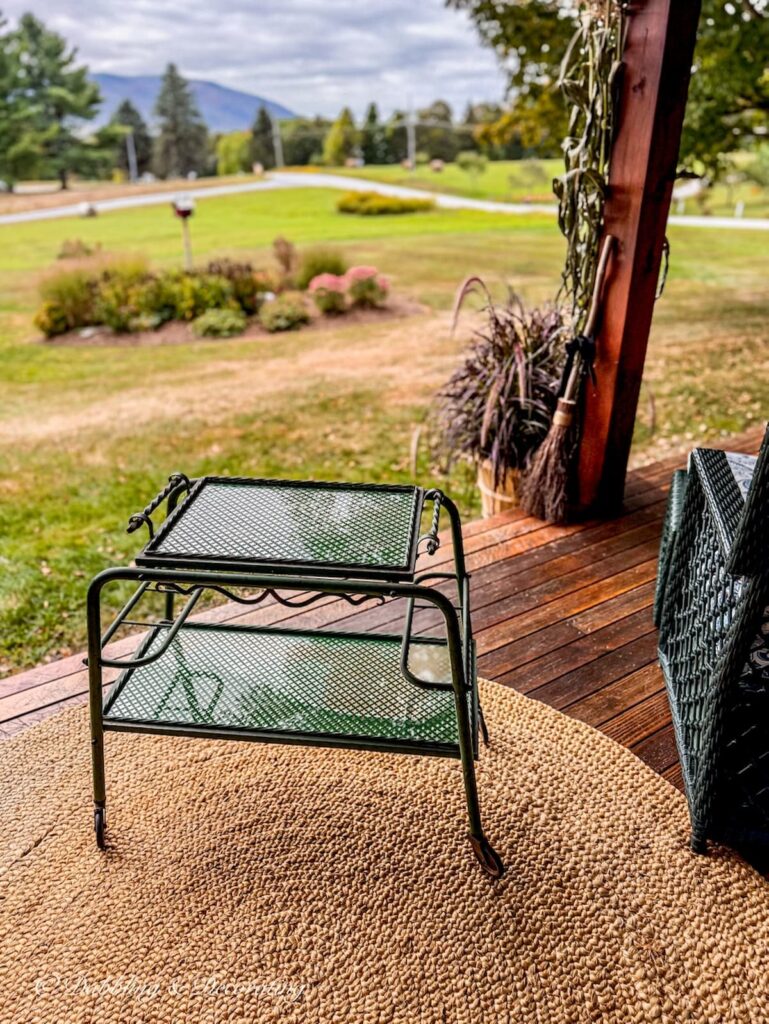 Antique Parisian beverage cart on fall porch.