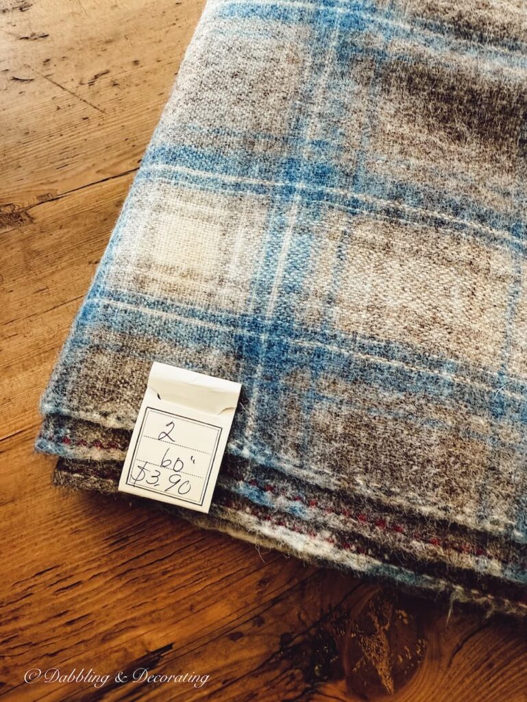 Blue and brown woolrich swatch blanket with factory code attached.