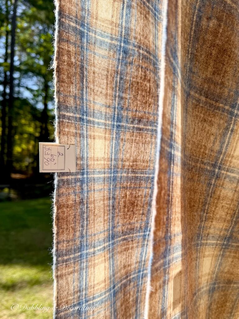 Vintage Blue and brown Woolrich swatch on clothesline with swatch tag.