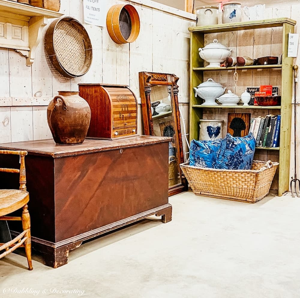 Antique large wooden trunk on display in vendor booth at Stone House Antique Center, Vermont.