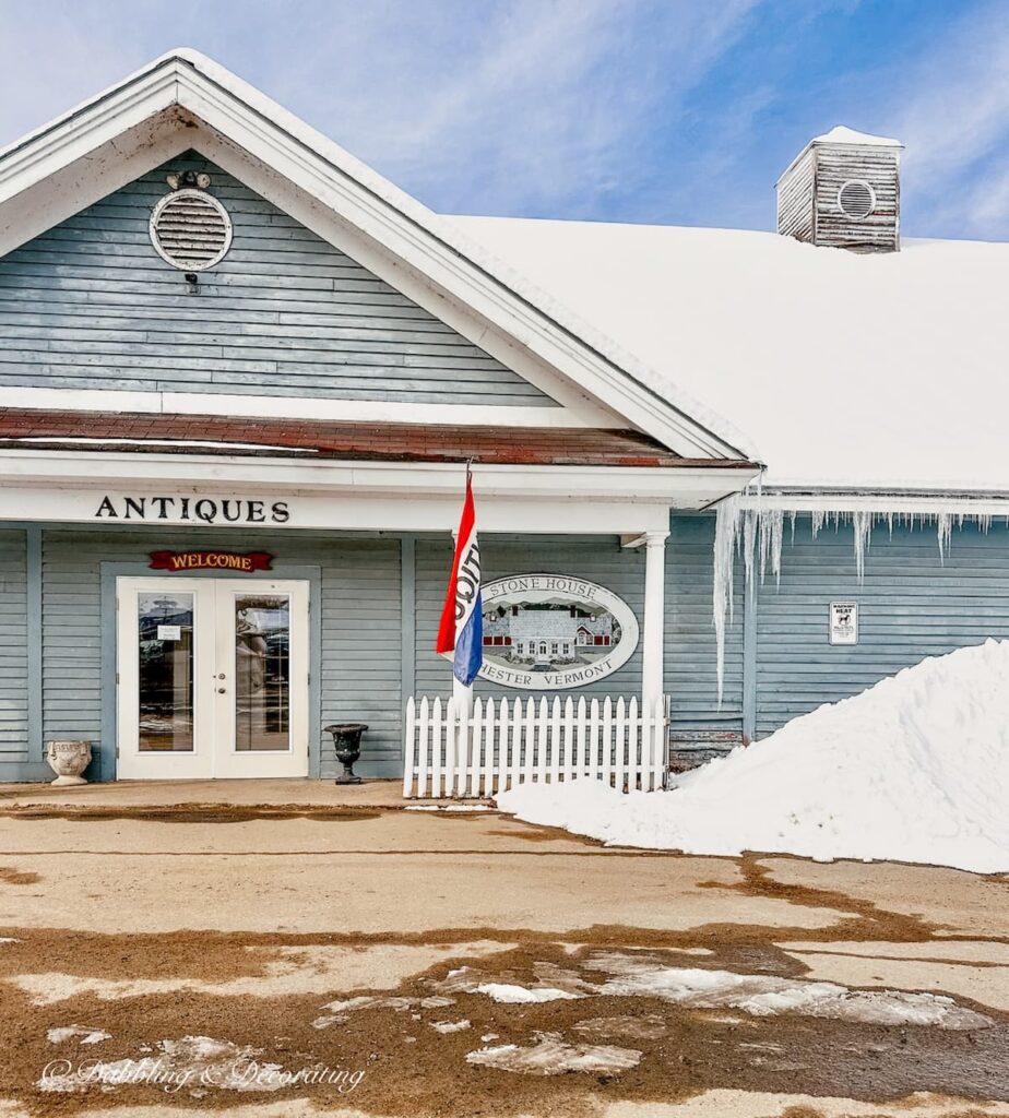 Stone House Antique Center in Chester, Vermont during the winter with snow.