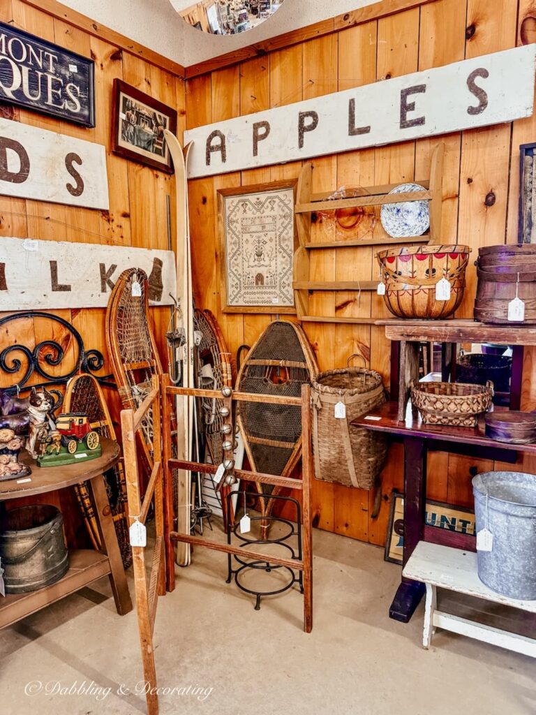 Inside a vendors booth at Stone House Antiques in Chester, Vermont with vintage ski lodge decor.
