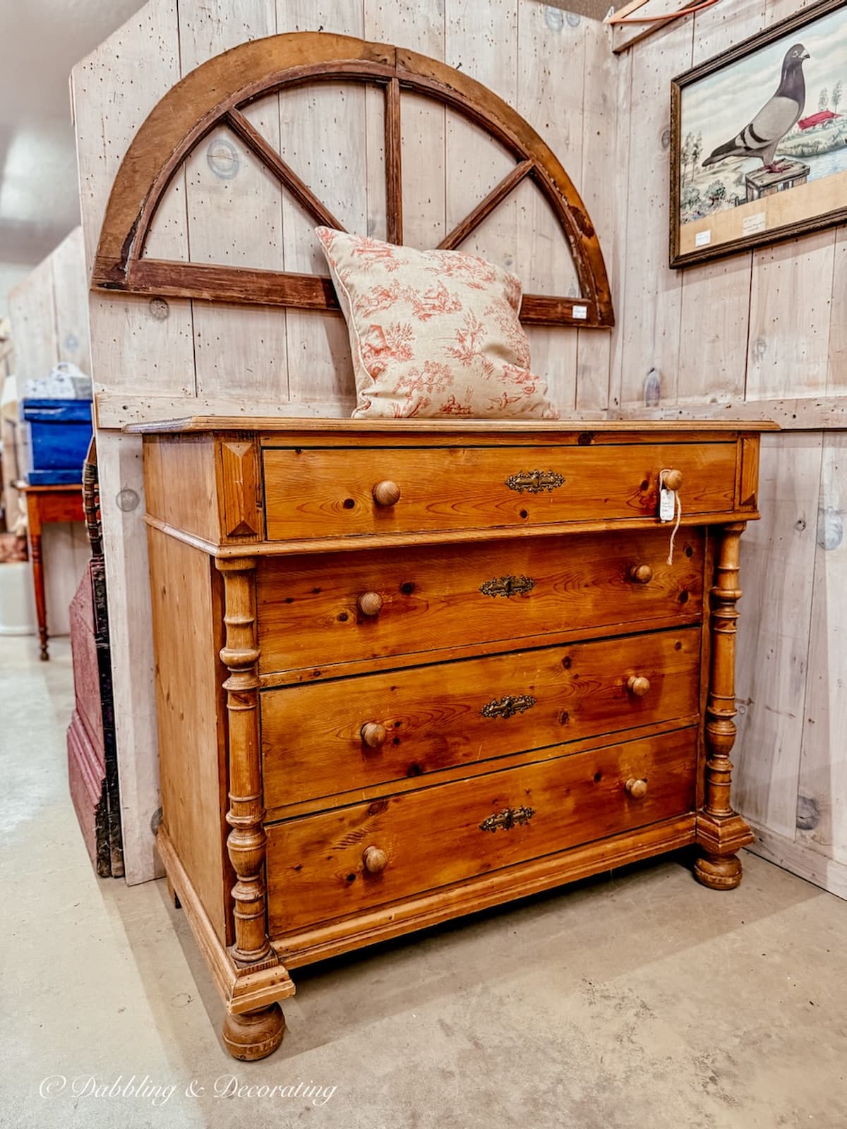 Antique chest of drawers in a booth at Stone House Antique Center in Chester, Vermont.