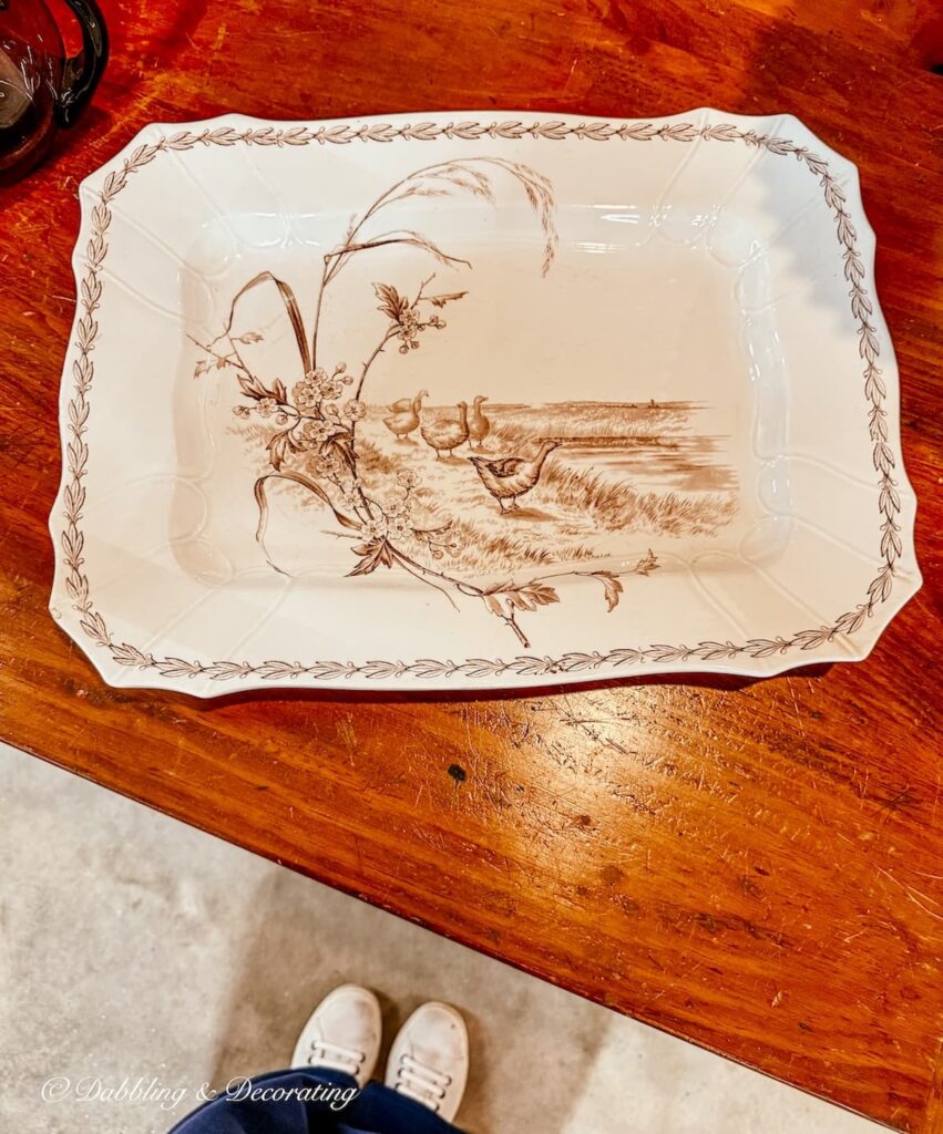 Brown and white Thanksgiving vintage platter in antique store.