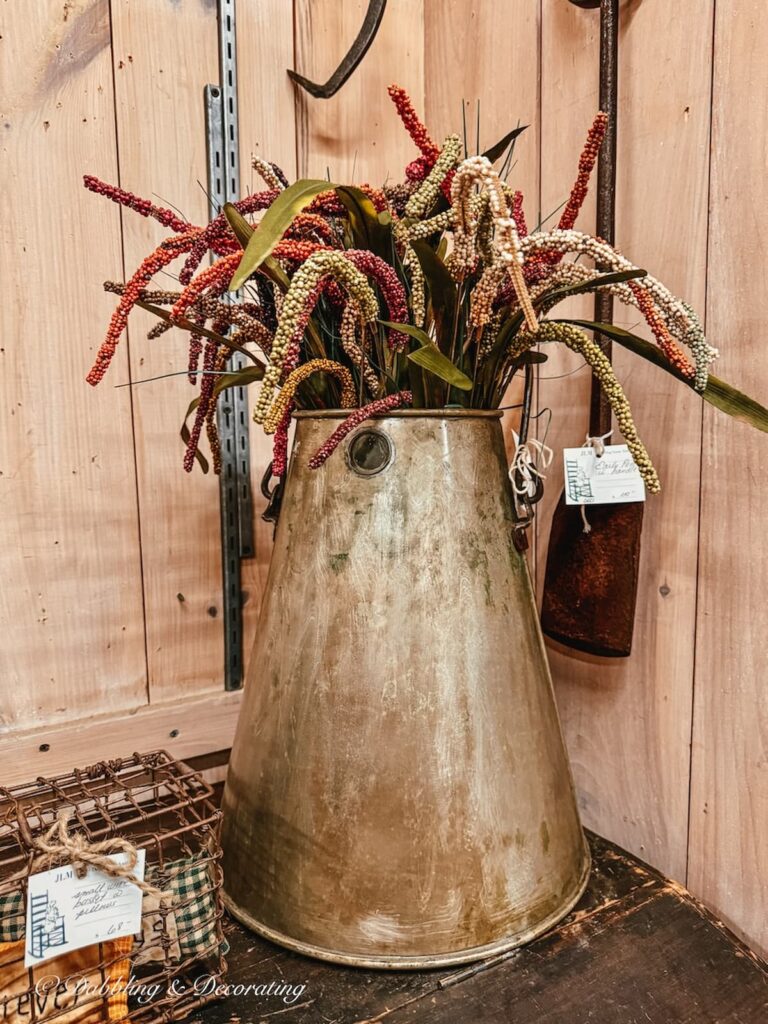 Large antique tin with colored elements for a unique Thanksgiving vintage decor centerpiece idea.