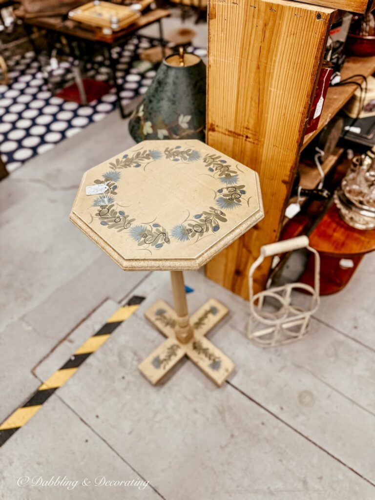 Small side table painted in blues and browns antiquing in the Berkshires.