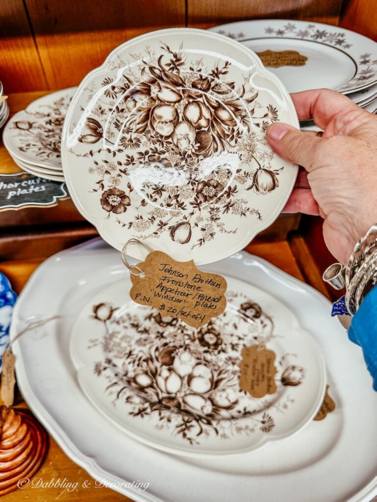 Brown and white transferware plates and platter antiquing in the Berkshires.