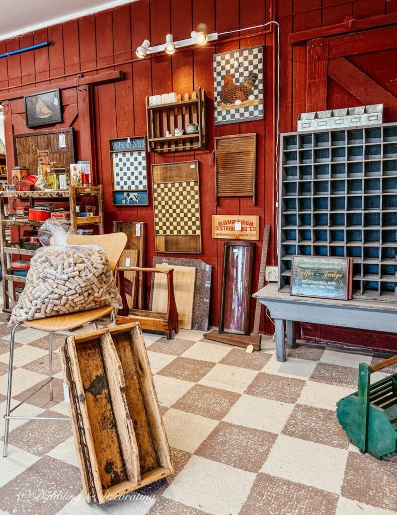 Primitive checker boards and furnishings vendor booth at Great Finds Antiques in Sheffield, Massachusetts antiquing in the Berkshires.