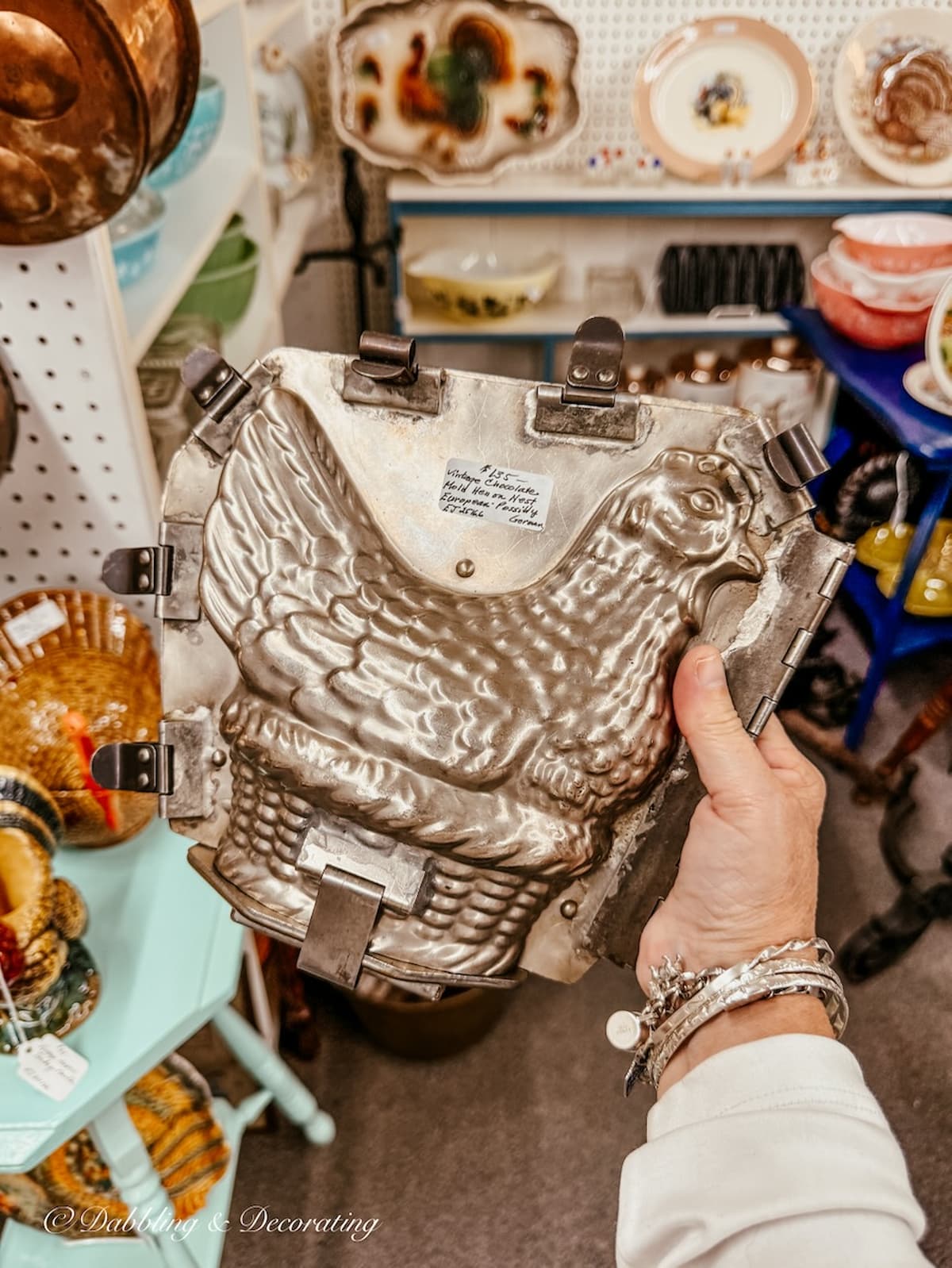 Antique German Chocolate mold of Hen in hand at antique store in the Berkshires.