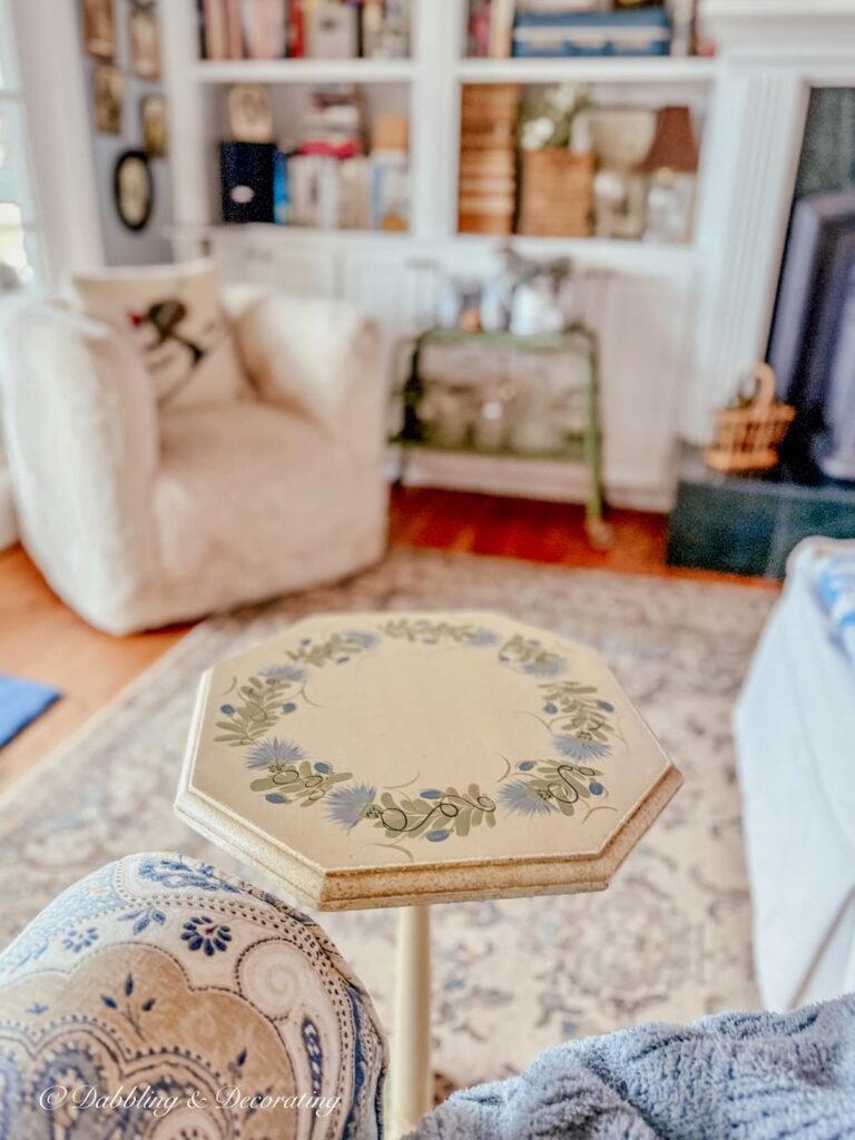Small side table in painted in blue and brown, an antique find from antiquing in the Berkshires.